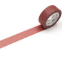 Roll of light vermilion tape with a visible brand label on a white background