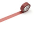 Roll of light vermilion tape with a visible brand label on a white background