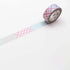 Roll of decorative tape with a pattern on a white background