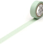 Roll of pastel ivy green tape with a white label on a white background