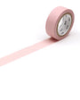 Roll of pink tape on a white background
