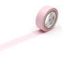 Roll of pink tape on a white background