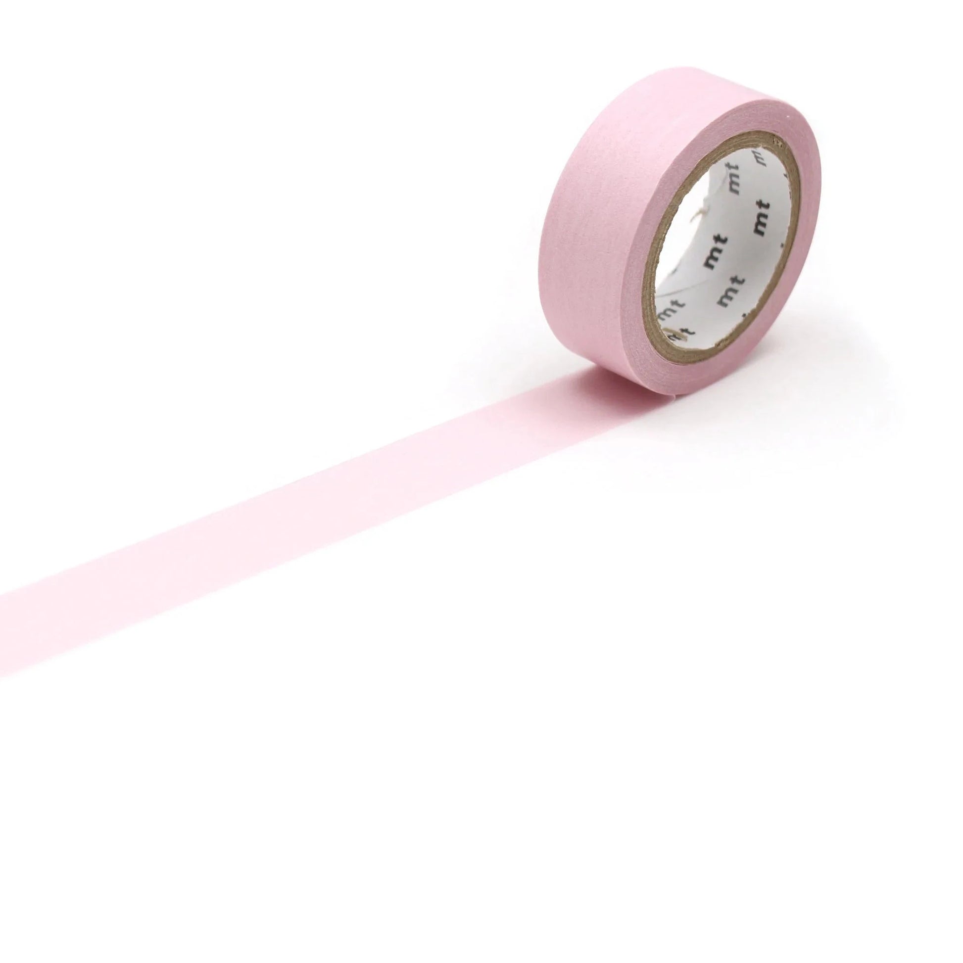 Roll of pink tape on a white background