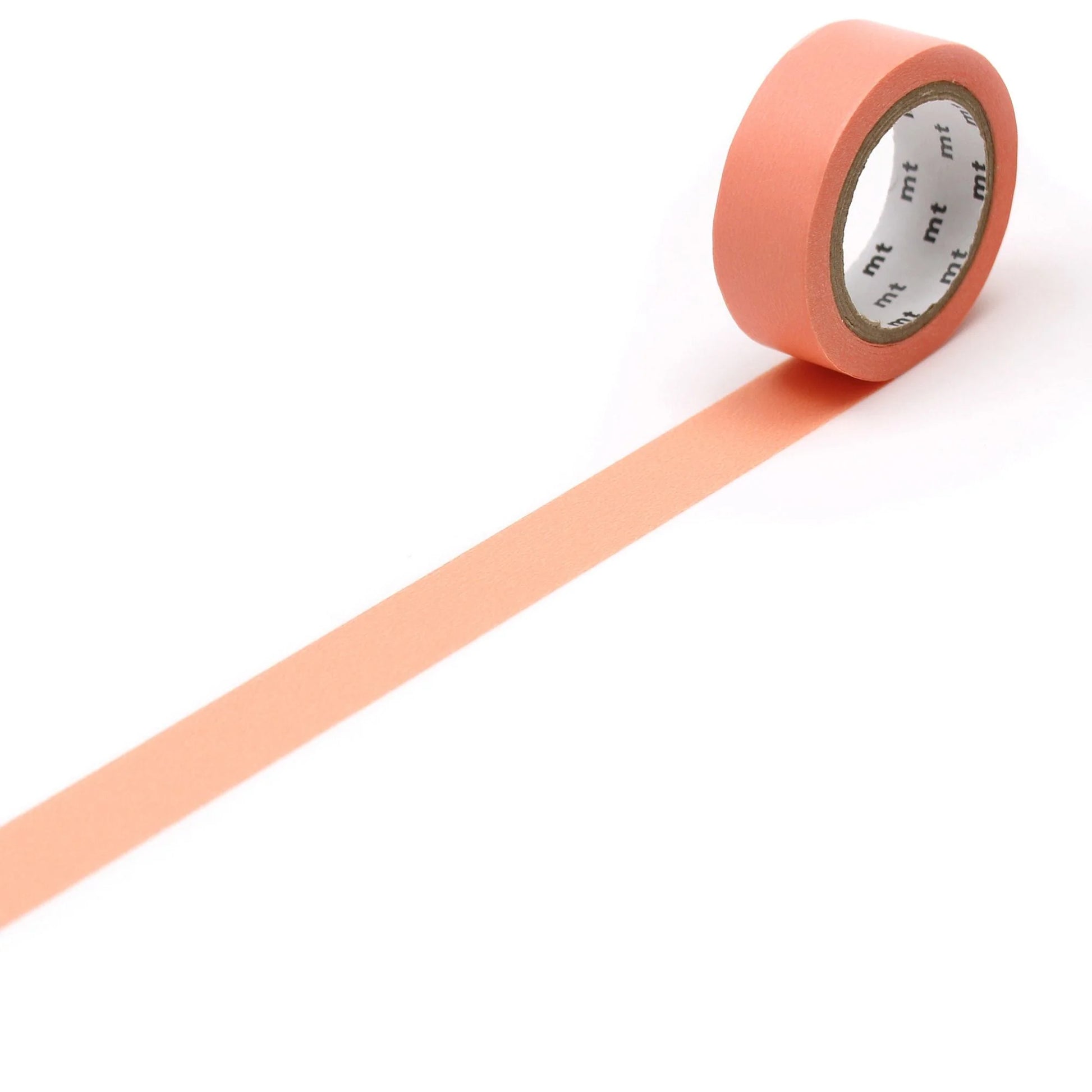 Roll of Salmon Pink coloured tape on a white background