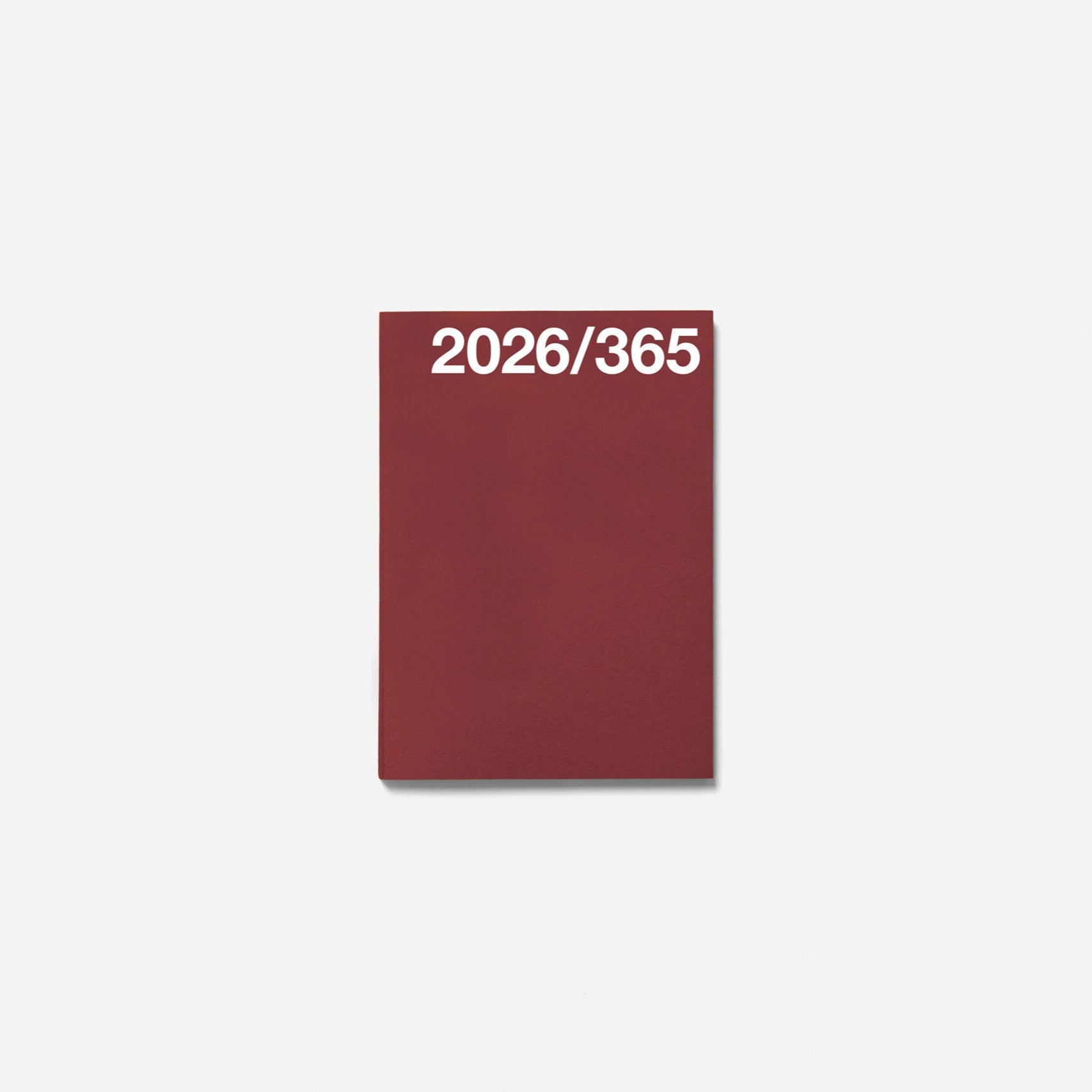 Burgundy notebook with '2026/365' text on a white background