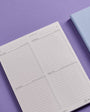 Planner with checklists on a purple background