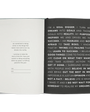 Open notebook with motivational text on a white background