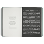 Open notebook with motivational text on a white background