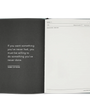 Open notebook with a quote by Thomas Jefferson on a white background