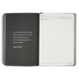 Open notebook with a quote by Thomas Jefferson on a white background