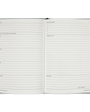 Open planner with checklists and notes on a white background