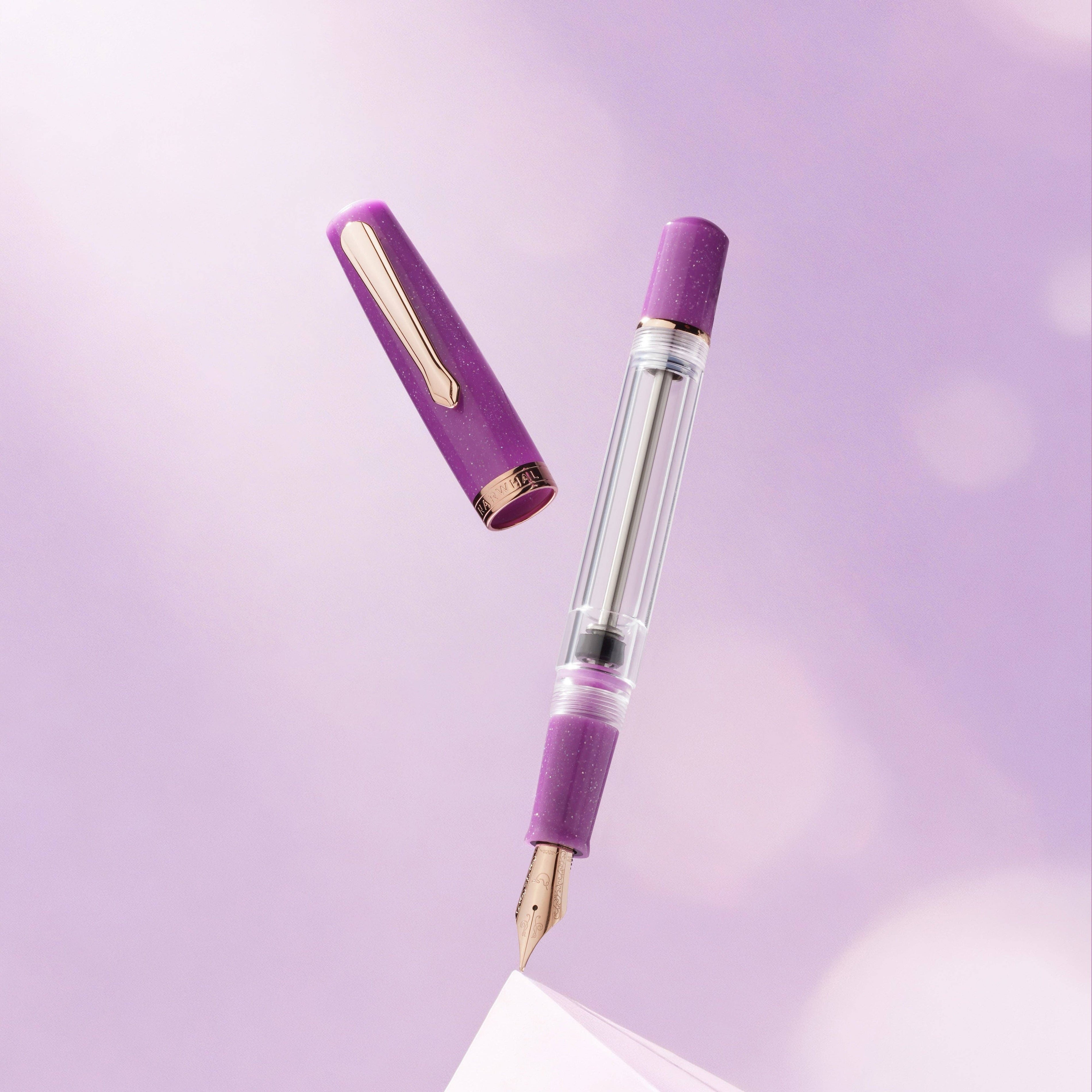 Purple fountain pen on a light purple background