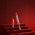 Red pen on a red platform with a red background