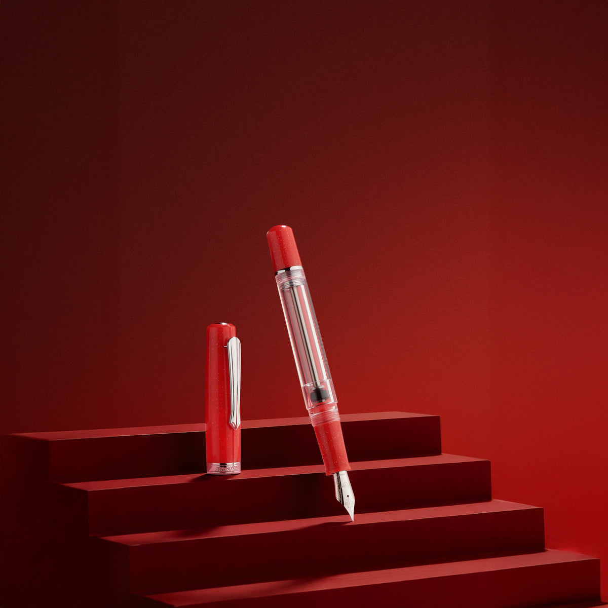 Red pen on a red platform with a red background
