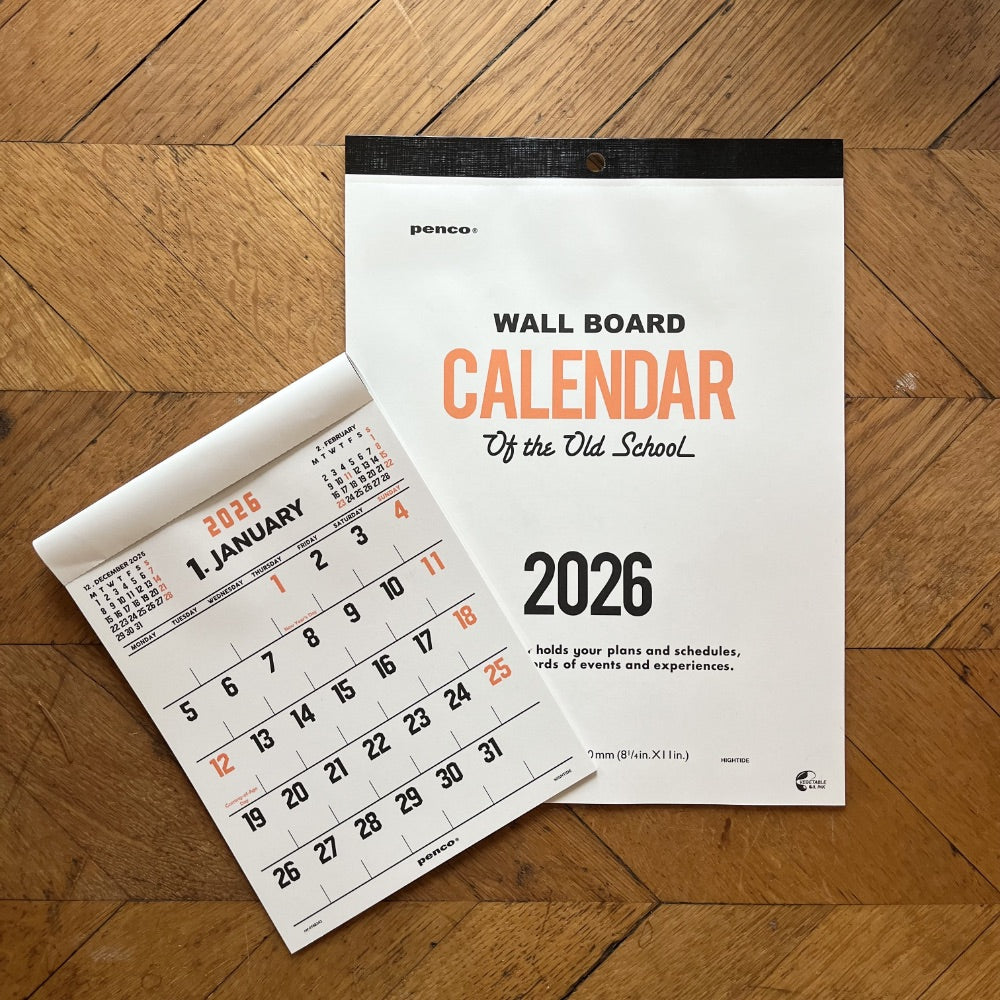 Wall calendar for the year 2026 on a wooden floor