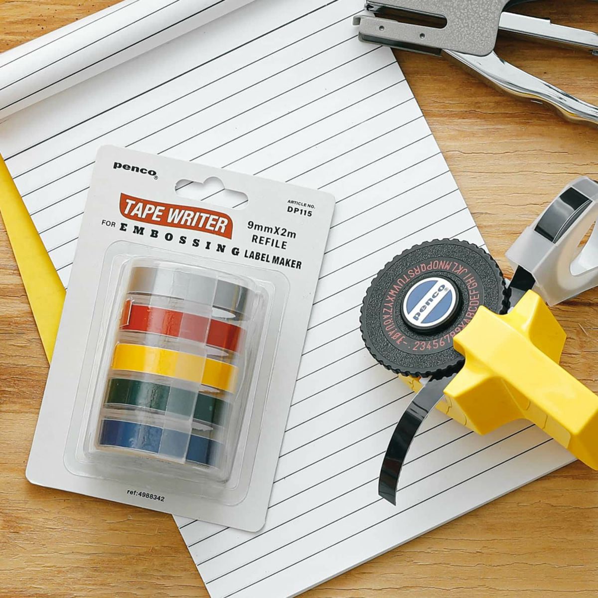 Penco Tape Writer embossing label maker with packaging on a wooden surface