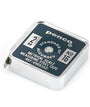 Penco measuring steel tape with black face and silver casing on a white background