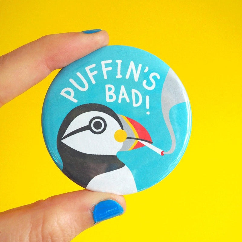 Button badge with puffin design and 'Puffin's Bad!' text on a yellow background