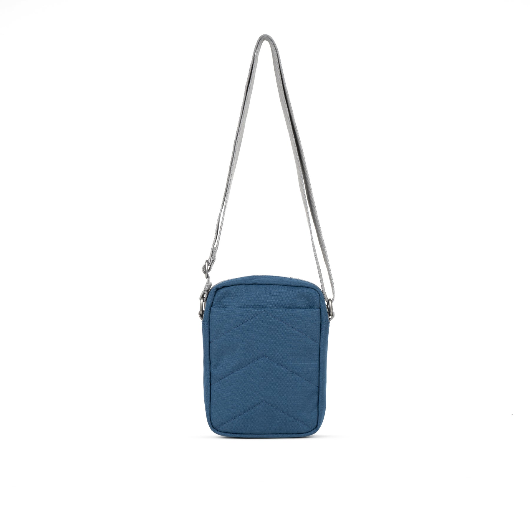 Blue crossbody bag with a zigzag pattern on a white background
