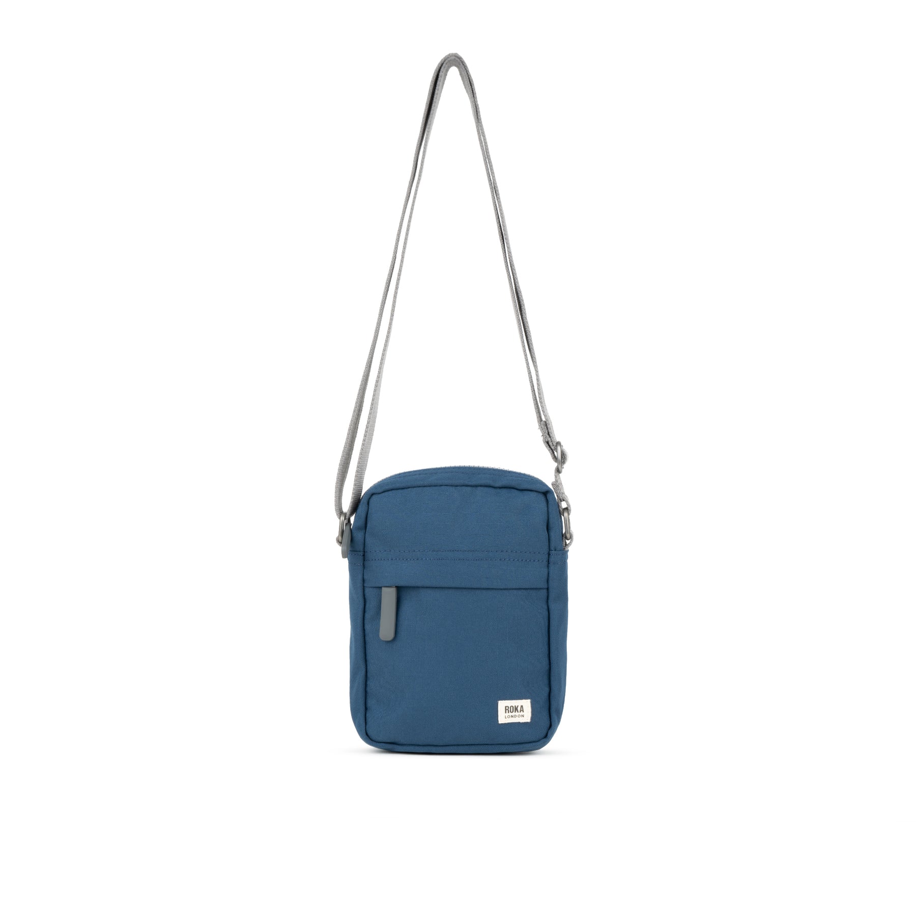Blue crossbody bag with a strap on a white background