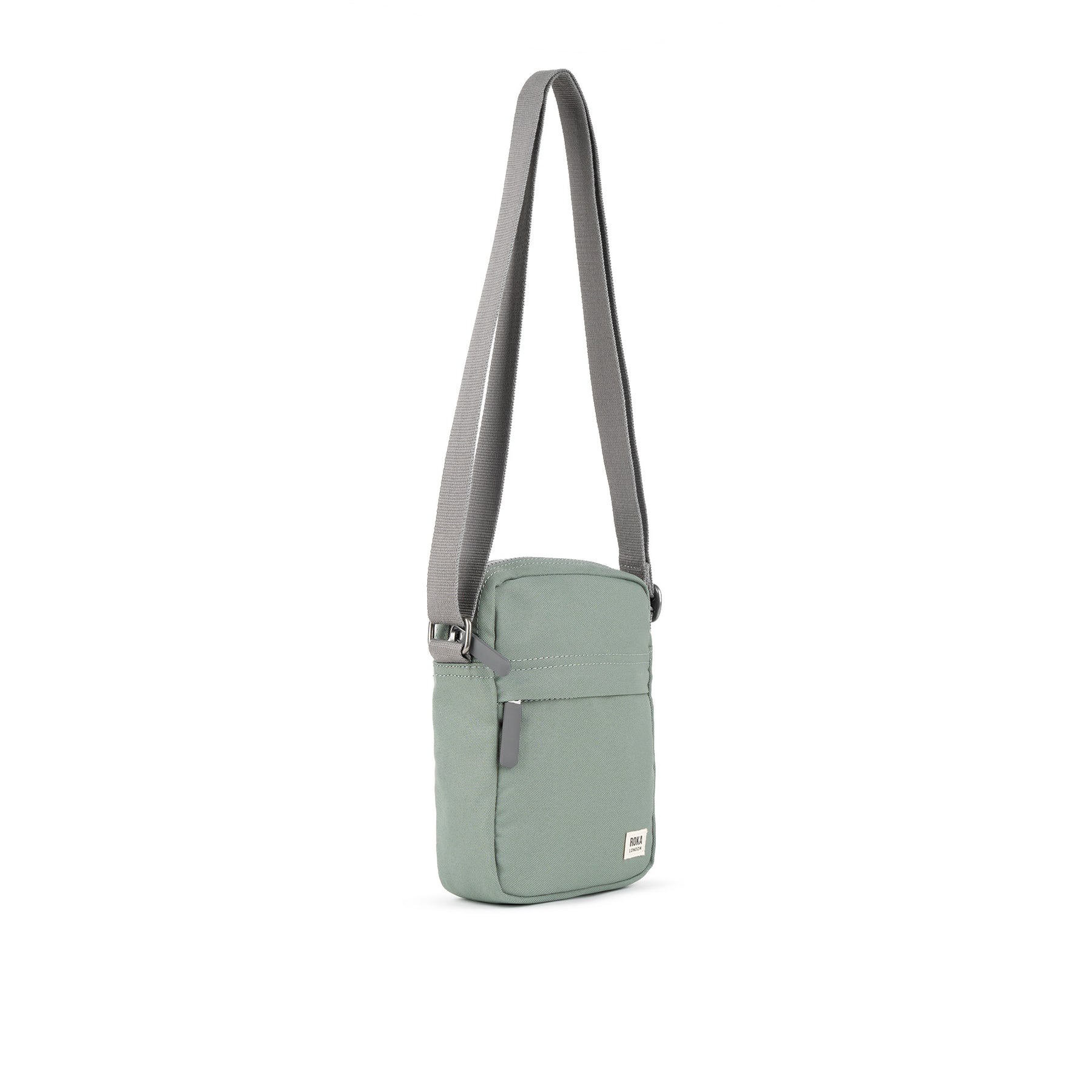 Pewter crossbody bag with a gray strap on a white background