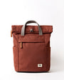 Brown backpack with gray straps on a white background