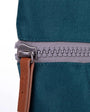 zip close up of teal coloured backpack