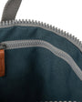 interior of dark grey coloured backpack on a white background