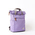 lavender coloured backpack on a white background