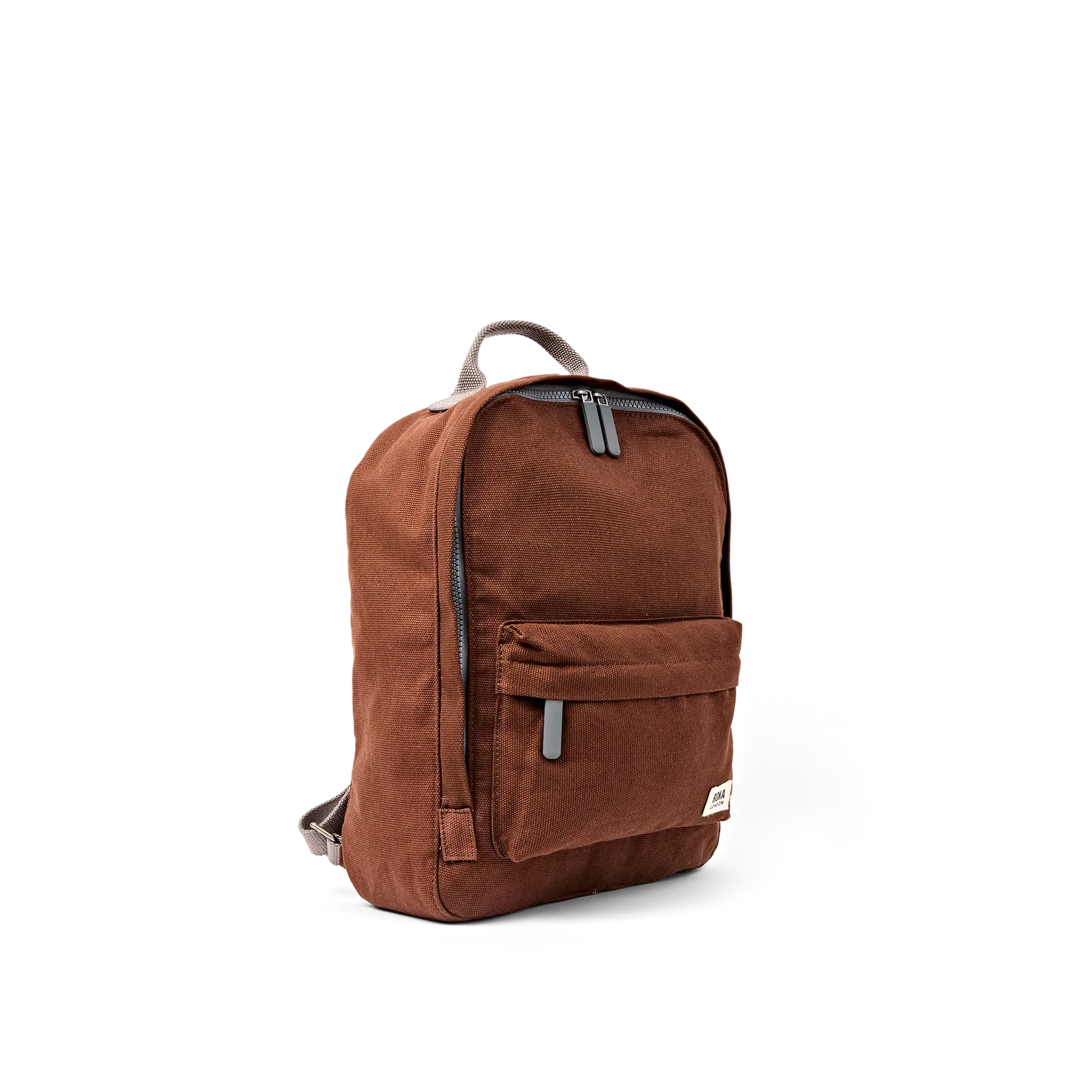 A brown canvas backpack with a front zippered pocket and gray zipper pulls, shown from a three-quarter angle on a white background.