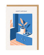 Greeting card with a blue cabinet, plant, and record player illustration, and 'Happy Birthday' text.