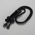 Black lanyard with two carabiners on a light gray background
