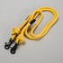 Yellow rope with black clasp on a gray background