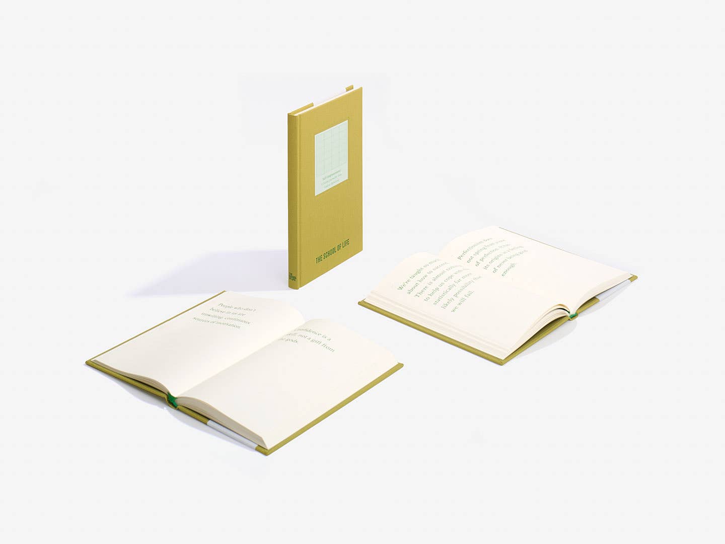 Two open notebooks with a yellow cover on a white background