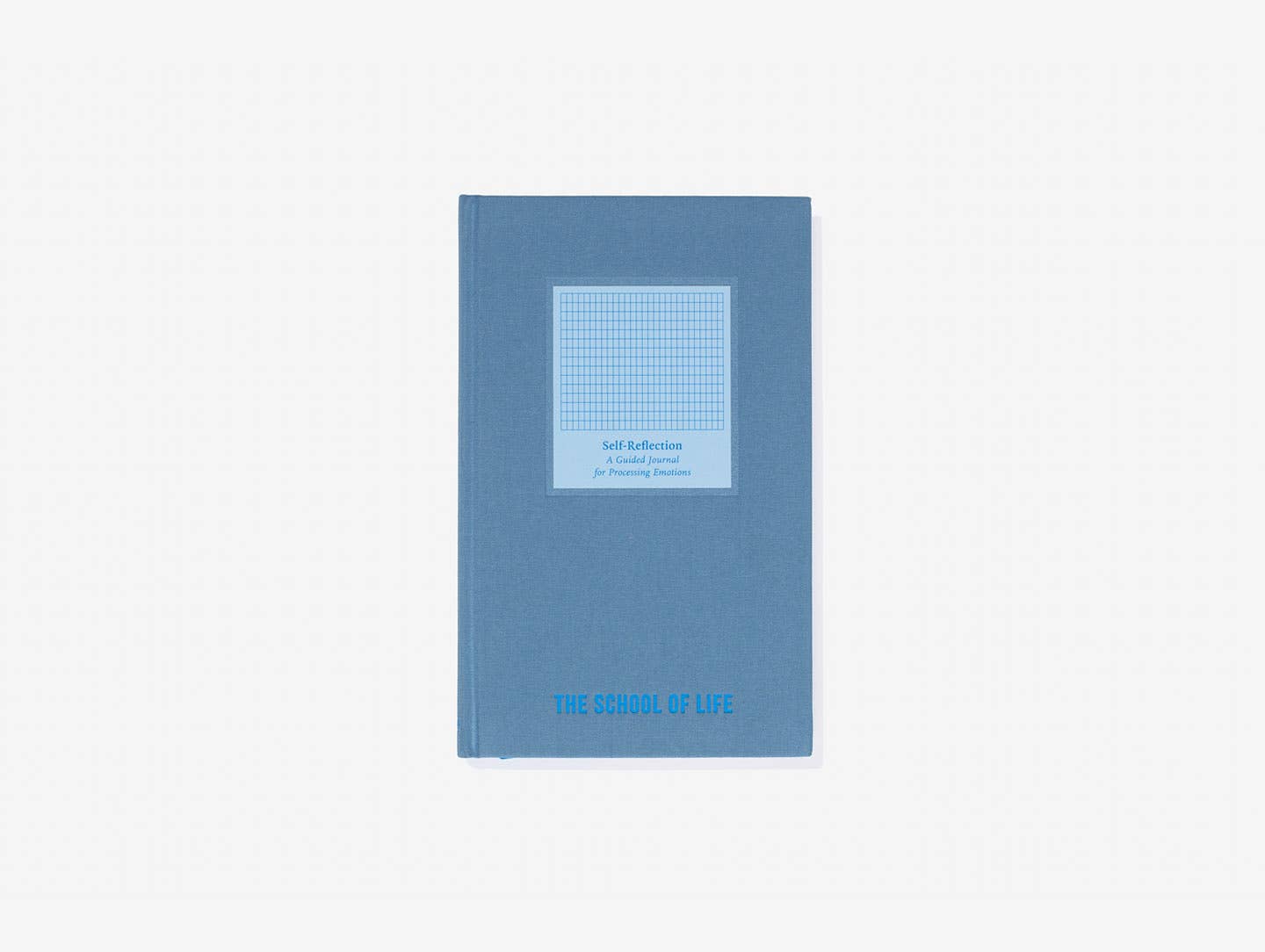 Blue notebook with a grid pattern on a white background
