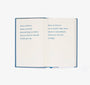 Open book with text on a white background