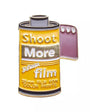 Enamel pin shaped like a 35mm film canister with 'Shoot More' text.