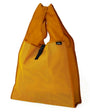 Yellow mesh bag with a brand label on a white background