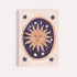 Notebook with sun and star design on a beige background