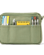 Green pouch with compartments holding stationery items on a white background
