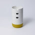 A collection of stackable organizer cases in various colors with a matte porcelain-like finish, designed to hold stationery items.