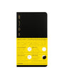 Black notebook with yellow label on a white background
