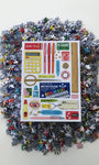Pile of puzzle pieces with a packaging sheet featuring various tools and items on a white background