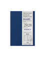 Blue and white diary with 'Traveler's notebook' branding on a white background