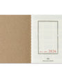 2026 planner with brown and white cover on a white background