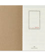 Two-tone notebook with brown and white cover, featuring 'Truebel's Company' branding.