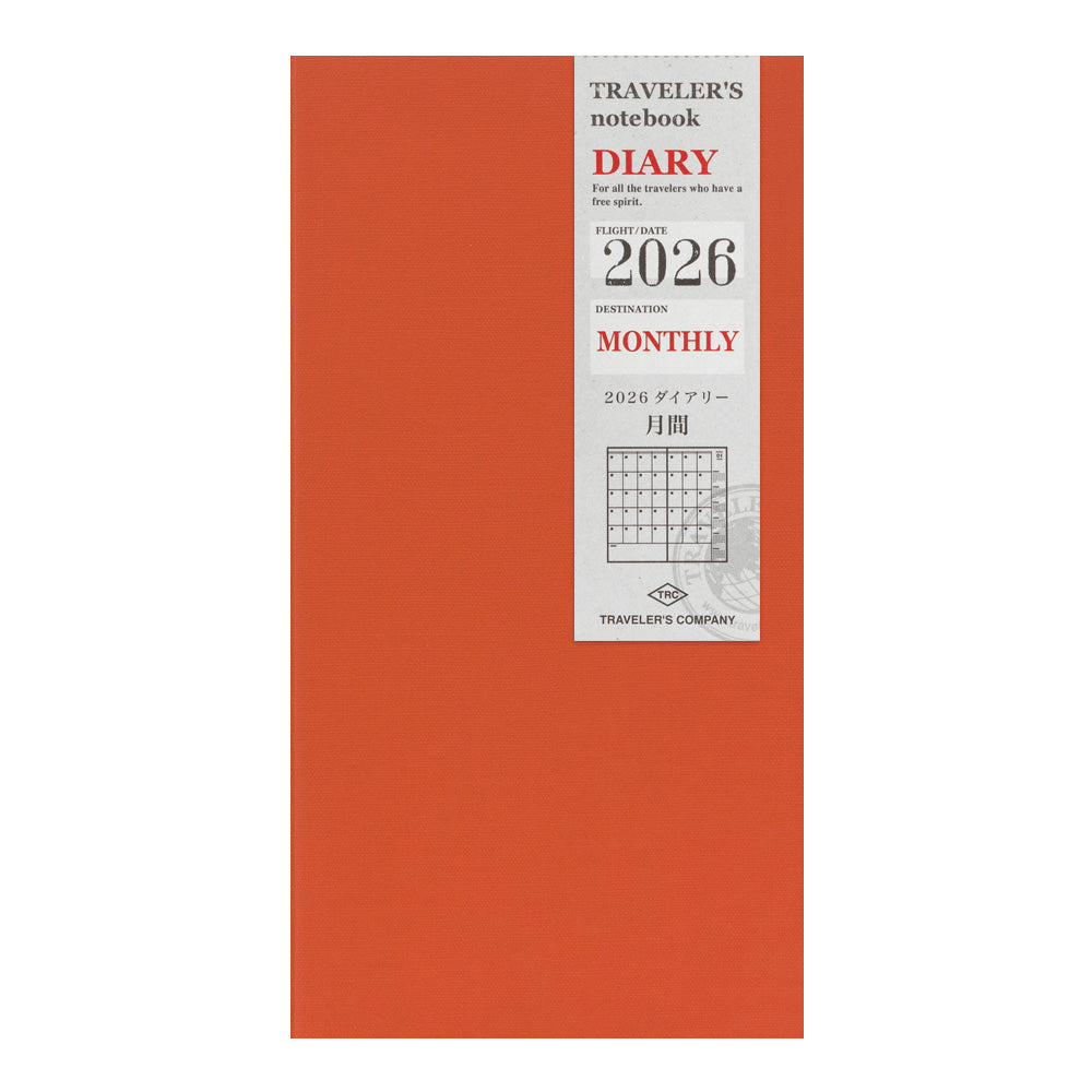 Red diary with a label indicating '2026' and 'Monthly' on a white background