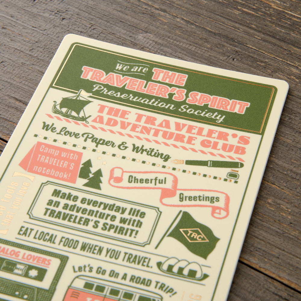 Vintage-style card with text and graphics on a wooden surface