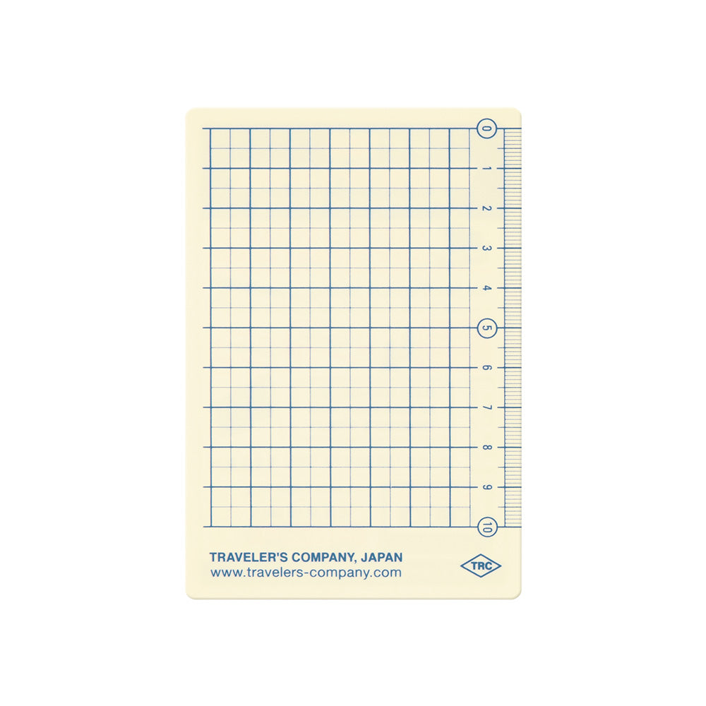 Grid notebook page with ruler and TRC logo on a white background