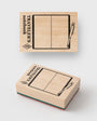 Two wooden stamps with 'Traveller's notebook' design on a white background